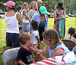 Youngster has face painted at Ocean Pines, Maryland 2004 4th of July celebration.