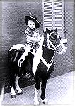 Photo of Joe Reynolds at 5 years or so of age on his trusty steed. This was taken at the corner of Cross and Carroll Streets in Southwest Baltimore where my grandparents operated a grocery store. Ther