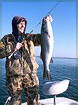Joe Reynolds shows off a 30-inch striped bass caught on 12/8/2007.