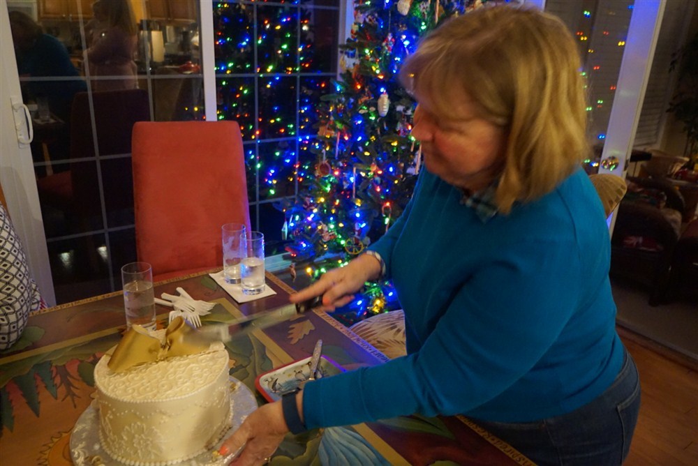 Claire cutting her cake