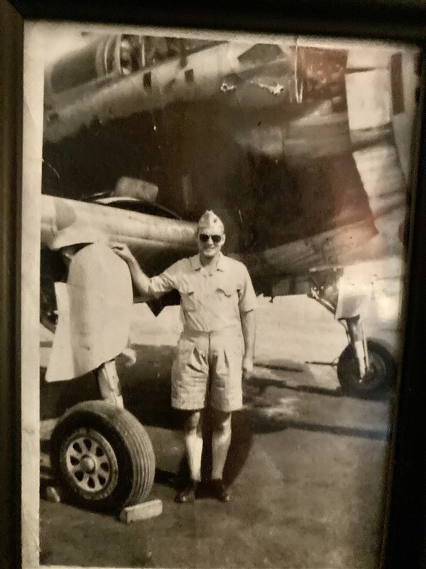 Dad in front of one of four planes