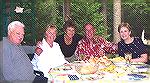 Memorial Day Weekend finds Pines residents Jerry Schmidt, Bobby Corbett, Olga Schmidt, Paul Corbett, and Jeanette Reynolds (left to right) enjoying dinner at the Schmidt's home prior to an evening of 