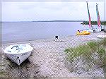 The sandy beach at the Coastal Kayak site permits easy launching for kayaks.