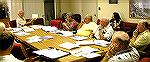 Meeting of Marine Activities Advisory Committee on 9/13/2004. Chairman Bob Abele, holding paper at upper left, makes a point during discussion.