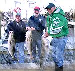 Proudly showing their striped bass catch are L to R Ward Parkin; Russ Applegit and Charlie Herpen 