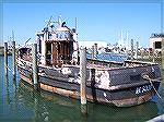 Old Army tug stripped and docked just down from Captains Galley in W. Ocean City. Will be towed off Ocean City and sunk for an artificial reef.
