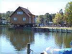 This house from Teal Bay was spotted on a barge at the Swim & Racquet Club just before it was scheduled to be moved by water to a new location below Chincoteague, Va.