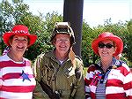 Sharyn O'Hare, Skip Carey, and Roseann Bridgman pose for a photo after dedication of Veternas Memorial.