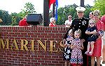 Marine Steve Rakow poses in front of the Marine &quot;Service Wall&quot; of the Veterans Memorial. Steve's dad, Bill Rakow, was unable to attend dedication but Bill was the construction manager for th