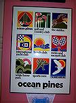 Photo of original Ocean Pines Poster depicting 8 amenities from the early years in the Pines. It had hung at Swim & Racquet Club and was donated to Veterans Memorial Auction by Edie Brennan and now ha