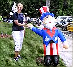 Jeanette Reynolds shakes hands with Uncle Sam at Sports Core Pool on July 4th.