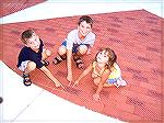 Luke, Daniel and Gracie Barnes find their Daddys brick at the OP Veterans Memorial.