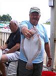 Captain John Henglein proudly shows off 19&quot; Flounder caught by mate Bill Baeder in first OP Anglers Club Flounder Flurry. 9/23/05