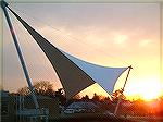 Photo taken 2-10-06 from window of moving car (maybe 40mph) at entrance to town of Cambridge, MD.  Just glad anything came out.  Love the shape of the sail.  Fuji Finepic. 