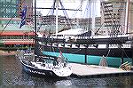 USS Constellation, last remaining Civil Warship afloat strikes a stark contrast to one of cutting edge technology sailboats at the Volvo Ocean Race stopover in Baltimores Inner Harbor.