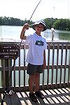 Daniel Barnes, visiting from Cranberry, Pa. catches a nice Perch at the South Pond