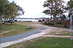 Supplies, construction vehicles and workers cars turn what should be a nice park at the Swim & Racquet Club into a mess. Before the stones were spread most supplies and vehicles were relegated to the 