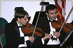 Nicholas Currie and Phanos Dymiotis, members of the Mid-Atlantic Symphony Orchestra, performing at the Ocean Pines Community Church on October 8, 2006.