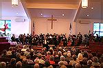 Andrea Barnes, President of the Mid-Atlantic Symphony Orchestra, introduces the audience to the second half music performance at the Ocean Pines Community Church on October 8, 2006.
