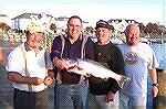 The Ocean Pines Anglers Club hosted its annual Rockfish Rumble on a beautiful Novenmber Day 2006. Shown in picture are the top place winners.  L to R; Ken Macmullin [tied 3rd], Walt 
Boge [1st place]