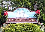 The decorations at the Harbor Village sign were put up as part of the &quot;Decorating Ocean Pines for the Holidays&quot; sponsored by the Ocean Pines Garden Club.  This event is open to all in the co