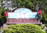 The decorations at the Harbor Village sign were put up as part of the &quot;Decorating Ocean Pines for the Holidays&quot; sponsored by the Ocean Pines Garden Club.  This event is open to all in the co