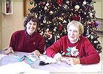 Gail Farrell and Jo Fran Falcon, greet volunteers and pass out job assignments, at the Community Hall on November 28th, for the &quot;Decorating Ocean Pines for the Holidays&quot; event.  All particip