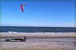 4 para surfers take advantage of the strong December winds off Assateague National Seashore.To the right and in the center of the picture you will see the two parasurfers that are offshore.