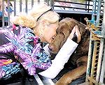 Vikki DiMisa is shown being reunited with her 9 year old chocolate lab Mocha who she credited with saving her life as the tornado tore through her home at the Villages in Lady Lake, Florida.