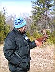 The &quot;Birds of Prey Photoshoot&quot; was held between 1 and 3PM at Pocomoke State Park, at Shad Landing, on Saturday, 2/17/07. 
Volunteer, Jim Duckworth, is transporting small Screech Owl to a tr