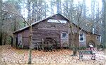 Reworked image by Tom Keech of Blacksmith Shop at Furnace Town Living Heritage Museum, Snow Hill, Md. Slight crop, and darkening via Photoshop Levels tool to correct slight overexposure of original.