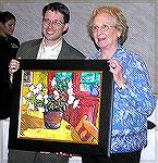 Mary Yenney stands with Nicholas Currie, during the Mid-Atlantic Symphony Orchestra’s  10th Anniversary dinner.  Nicholas donated for the live auction, “White Azaleas” an original piece of art he pain
