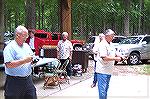 Roger Baumgartner and Mo Constant try their luck at the casting contest during Anglers Club annual picnic.