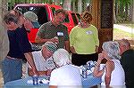 John McFalls rallies his team during the trivia contest at the Anglers Club annual picnic in White Horse Park.The teams finish was directly proportionate to the number of beer cans visible???? 