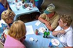 Andrea Barnes, Tim & Joan Mullins and Kathy Bellstri team up in the trivia game at the Ocean Pines Anglers Club picnic in White Horse Park. Unfortunately their efforts, despite all the brain power, di