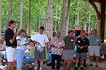 Budd Heim with help from Dick and Mariana Nieman draw the winning prize tickets while members of the picnic committee keep a watchful eye out at the Ocean Pines Anglers Club annual picnic in White Hor