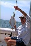 Ocean Pines Angler Mike Gough holds up what one would expect to catch in an event called the MSSA Flounder Tournament. Mike traveled over 13 miles offshore enduring 6 to 9 foot seas for his catch  and