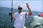 Ocean Pines Angler Rick Kubiak is shown with the fish he attempted to pass off as a flounder in the MSSA Flounder tournament. His attempts at flattening out the bluefish were for naught. It was somewh