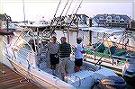 It is 7am at the Yacht Club Marina and boat Captain and Ocean Pines Angler Fred Lynn discusses fishing strategy with angler Mike Dough as Rick Kubiak contemplates that &quot;Big One&quot; yet to be ca