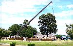 Workers prepare steel framework for Sports Core pool enclosure. Frame is prefinished in white. Covering panels are supposed to be a &quot;brick&quot; color but don't appear to be on the site as yet.