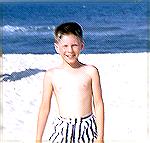 Young Marty Clarke on the beach.