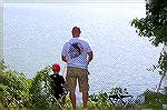 7 year old Max Downs gives his Dad some pointers at the Ocean Pines Anglers Club Kids Fishing Tournament at the South Pond.