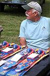 Ocean Pines Angler Club member Dave Rippy keeps a close eye on some of the prizes given to youth at the Ocean Pines Anglers Club, Kids Fishing Tournament.  