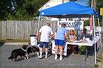 Elaine Brady [foreground], owner of the Gazette newspaper and Andrea Barnes [background] president of the Mid Atlantic Symphony Society help out at Snow Hills annual &quot;Dog Days of Summer&quot; eve