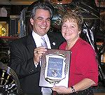 Folks at the Ocean Pines Area Chamber of Commerce Annual Dinner 2007. Chip Bertino (left), incoming vice-president presents Citizen of the Year Award to Marie Gilmore.