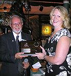 Folks at the Ocean Pines Area Chamber of Commerce Annual Dinner 2007. Incoming president presents outgoing president with award.