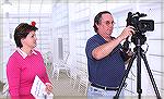 Image from Grand Opening of the Ocean Pines Sports Core indoor pool enclosure on 10/13/2007. Deserie Lawrence, new Marketing and Public Relations person for OPA and Dave Schwarten prepare to video eve