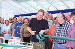 Image from Grand Opening of the Ocean Pines Sports Core indoor pool enclosure on 10/13/2007. OPA board member Reid Sterrett cuts the ribbon at the grand opening ceremony.