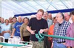 Image from Grand Opening of the Ocean Pines Sports Core indoor pool enclosure on 10/13/2007. OPA board member Reid Sterrett cuts the ribbon at the grand opening ceremony.