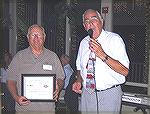 Charles Herpen, Ocean Pines Board member presents a certificate of appreciation to Ocean City-Berlin Optimist President Steve Acton for their financial support of the Anglers Youth programs. 
